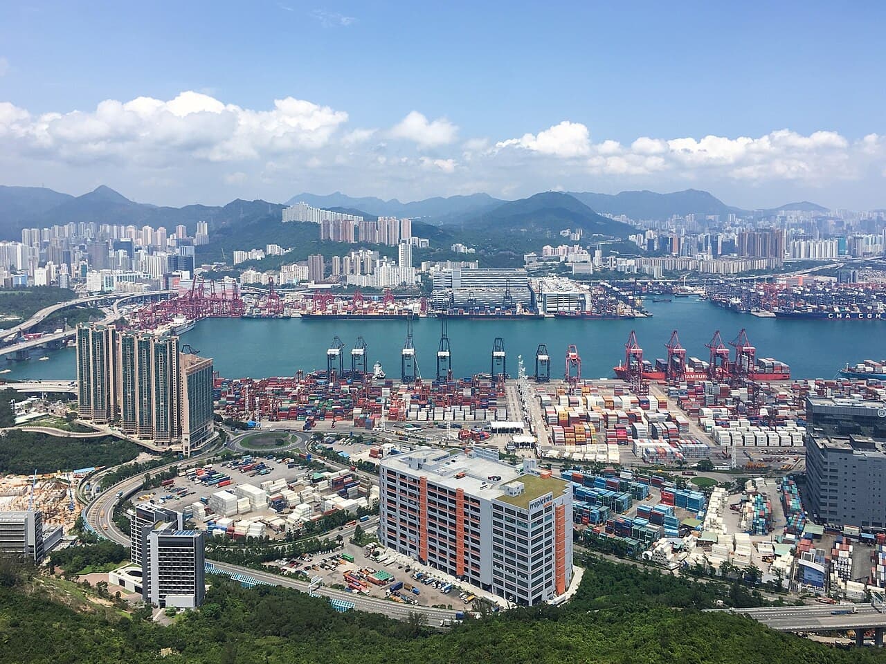 A real photograph of Hong Kong’s Kwai Tsing container terminals, used as a scene illustration.