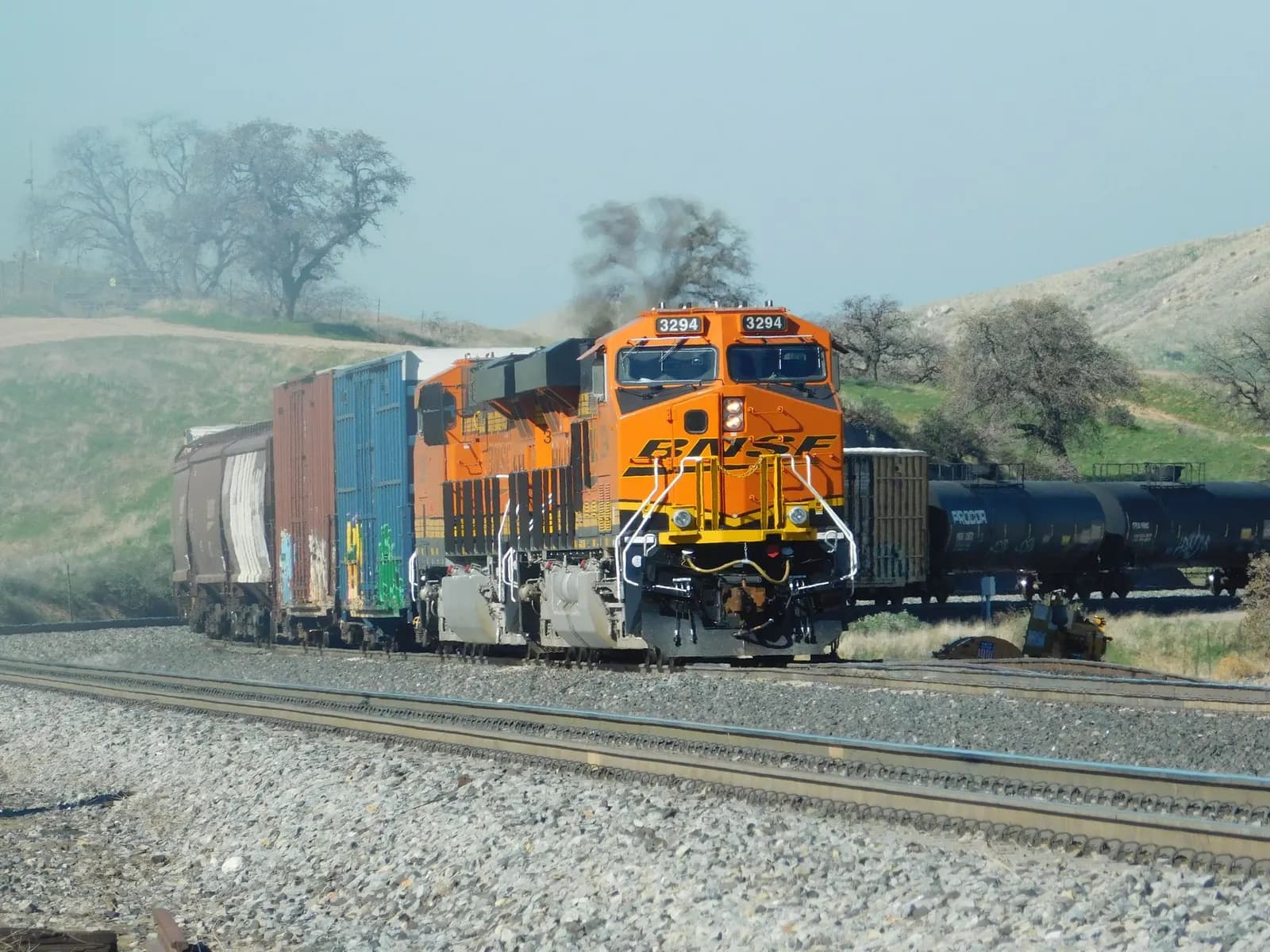 A BNSF freight train on rural tracks in California, United States.