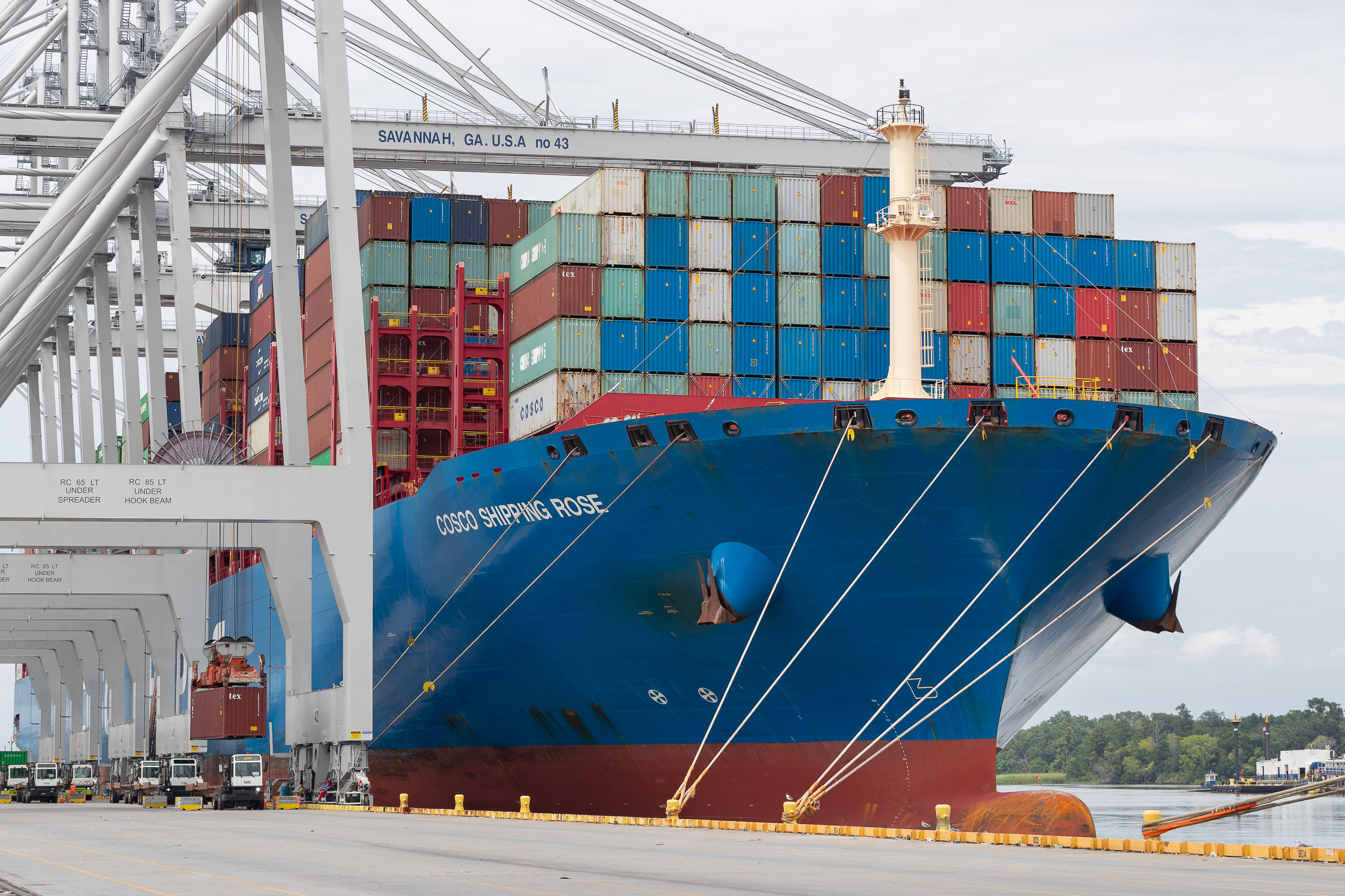 Historical photograph of quay cranes unloading a container ship at the Port of Savannah
