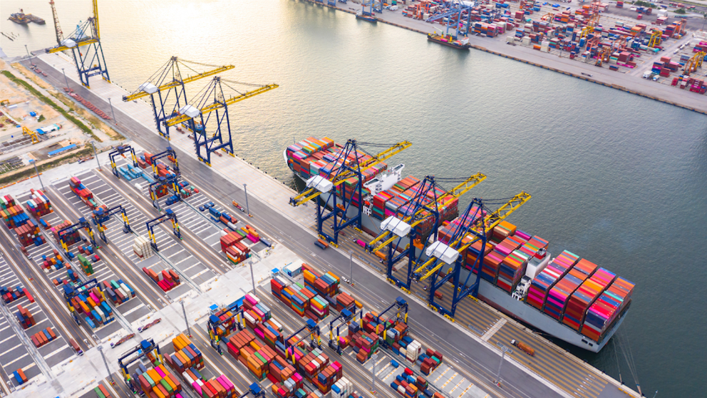 Aerial view of container-terminal cranes and a berthed container ship