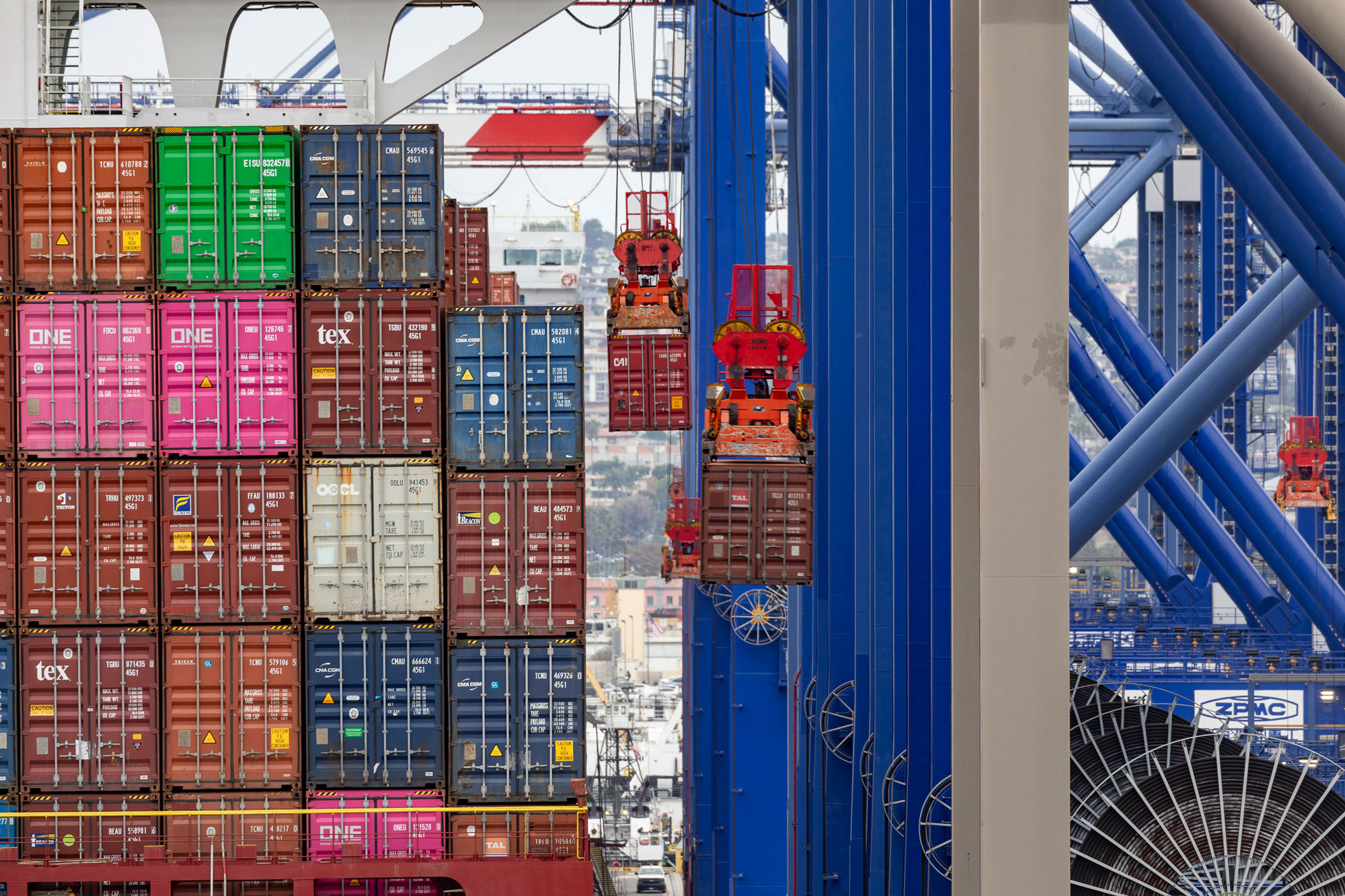 A ship-to-shore crane lifts a container from a vessel at the Fenix terminal, Port of Los Angeles.